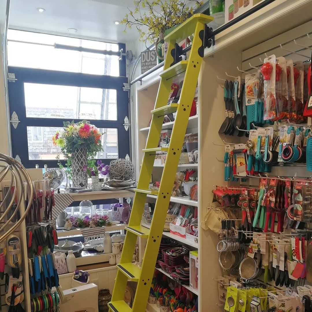 Lime green rolling ladder in a kitchenware shop